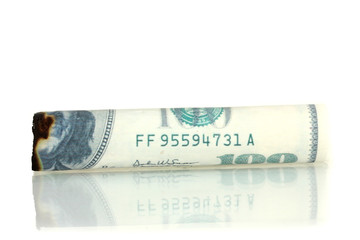 Cigar of the 100 dollar bill isolated on white