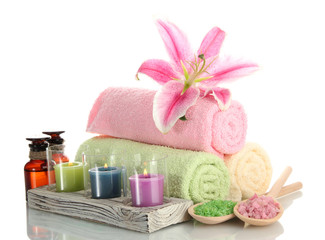 towels with lily, aroma oil,  candles and sea salt isolated