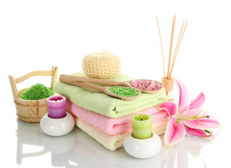towels with lily, aroma oil,  candles and sea salt isolated