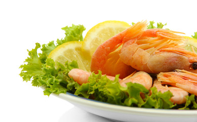 Boiled shrimps with lemon and lettuce leaves