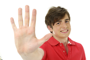 Young man holding up hand, focus on hand