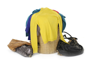 Basket full of fashion colorful shirt with scarf, handbag