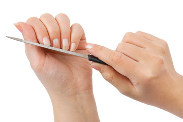 Hands and manicure nail file