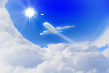 Fototapeta na wymiar Biały samolot pasażerski w błękitne niebo