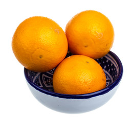 Heap of oranges in the dish