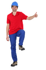 Builder stood with blank poster