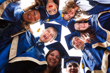 Group of happy young graduates