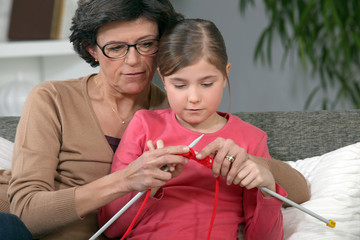 Little girl learning to knit