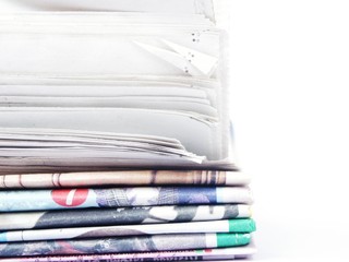 Stack of newspaper on white background
