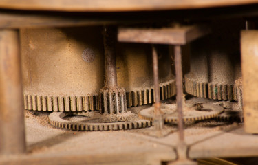 Dusty gears inside of a clock