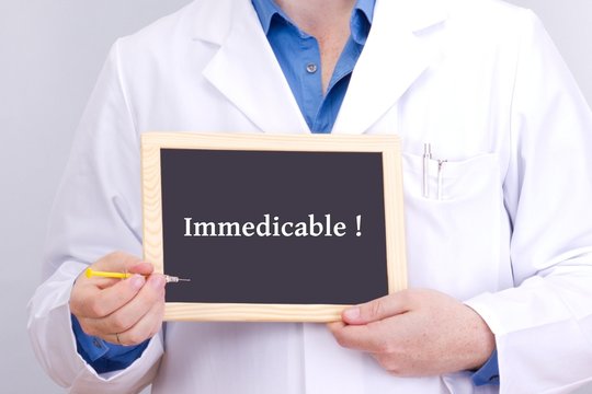 Doctor shows information on blackboard: immedicable!