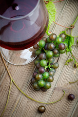 Red wine with grapes