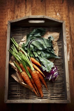 Carrots and kohlrabi on a wicker tray