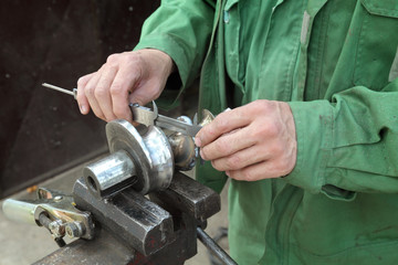 Steel helicoid shaft measuring with caliper, metalwork