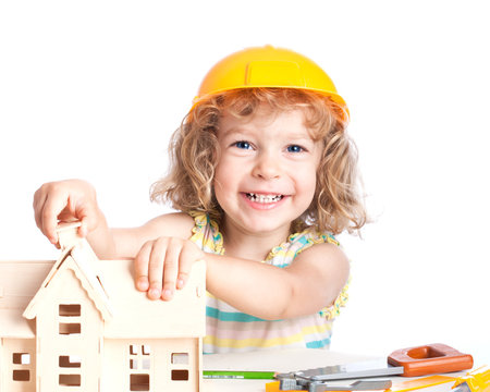 Child building house