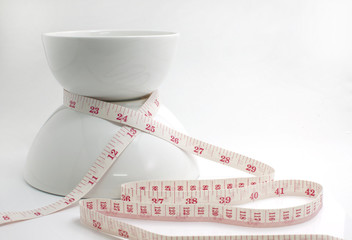 White bowl  With Tape Measure on white background