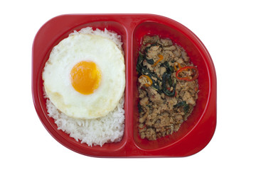 Chicken sauteed with garlic and hot basil set on steamed rice wi