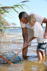 Father and son fishing together