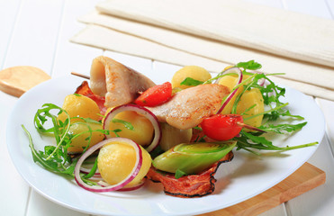 Fish skewer with potato side dish