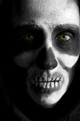 Scary skeleton on black background