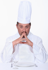 Chef sitting at a table