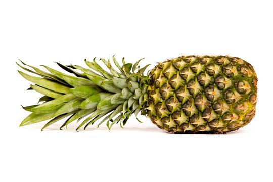 Single pineapple isolated on white