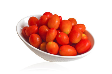Red tomatoes in a white bowl.