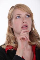 Horrified woman looking up at the sky