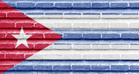 Cuba flag on an old brick wall