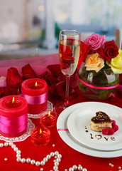 Table setting in honor of Valentine's Day on room background