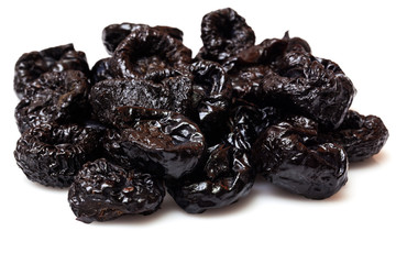 Dried fruit prune closeup on white background