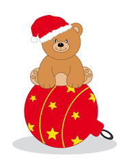 Oso sentado en una bola del árbol de navidad
