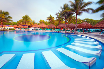 Morning at tropical swimming pool in Mexico