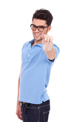 Casual young man pointing