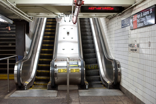 Interior view with escalators of subway station in NYC.