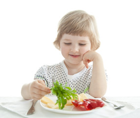 Pretty little girl demonstrating fresh parsley