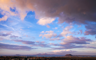 Sunset lit clouds over Corralejo