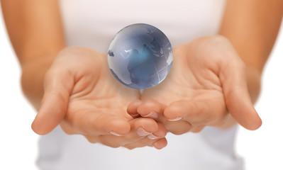 woman hands holding earth globe