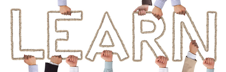 Hands holding letters forming LEARN tag