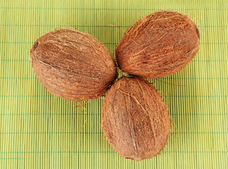 coconuts on a green wicker mst close-up