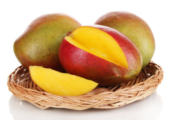 Ripe appetizing mango on wicker cradle isolated on white