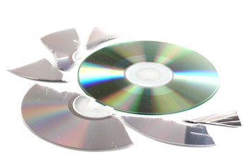 Broken and whole disks with information isolated on white