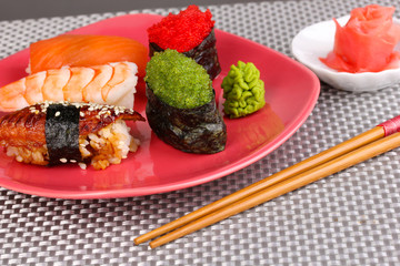 delicious sushi served on plate close-up