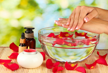 spa treatments for female hands,  on green background