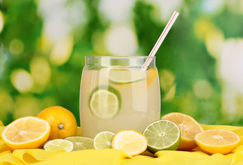 Citrus lemonade in glass bank of citrus around