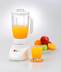 Fruits and orange juice blender