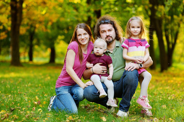 Fototapeta premium Family of four at autumn