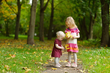 Fototapeta premium Two sisters on beautiful autumn day