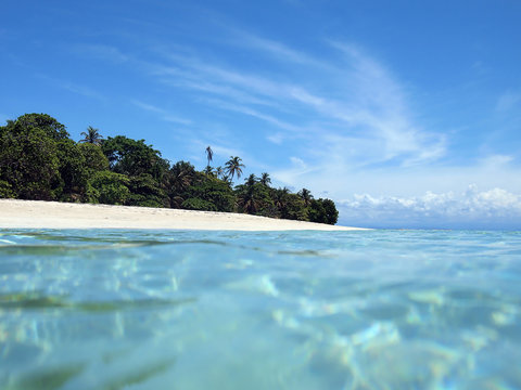 Pristine tropical island with sandy beach in the Caribbean, seen from sea surface, Panama, Central America