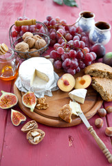 Cheese, bread and autumn fruit